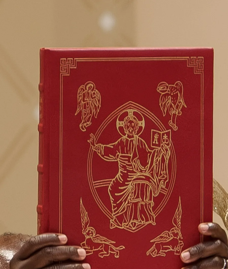 The illuminated Book of the Gospels raised during Mass